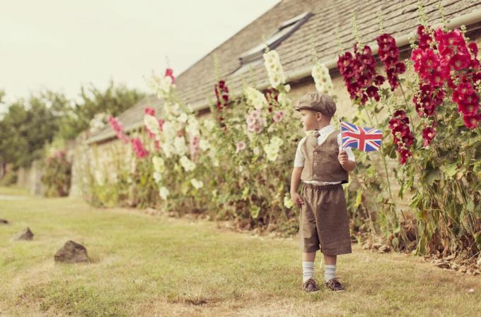 Vintage British Boy Standing With Union Jack