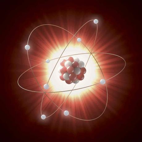 Illustration av en atomkärna som en serie röda och vita cirklar, kretsade av elektroner representerade av vita cirklar.