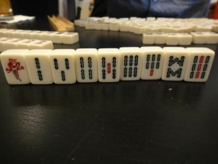 Bambusdräkten av en Mahjong-kakeluppsättning.